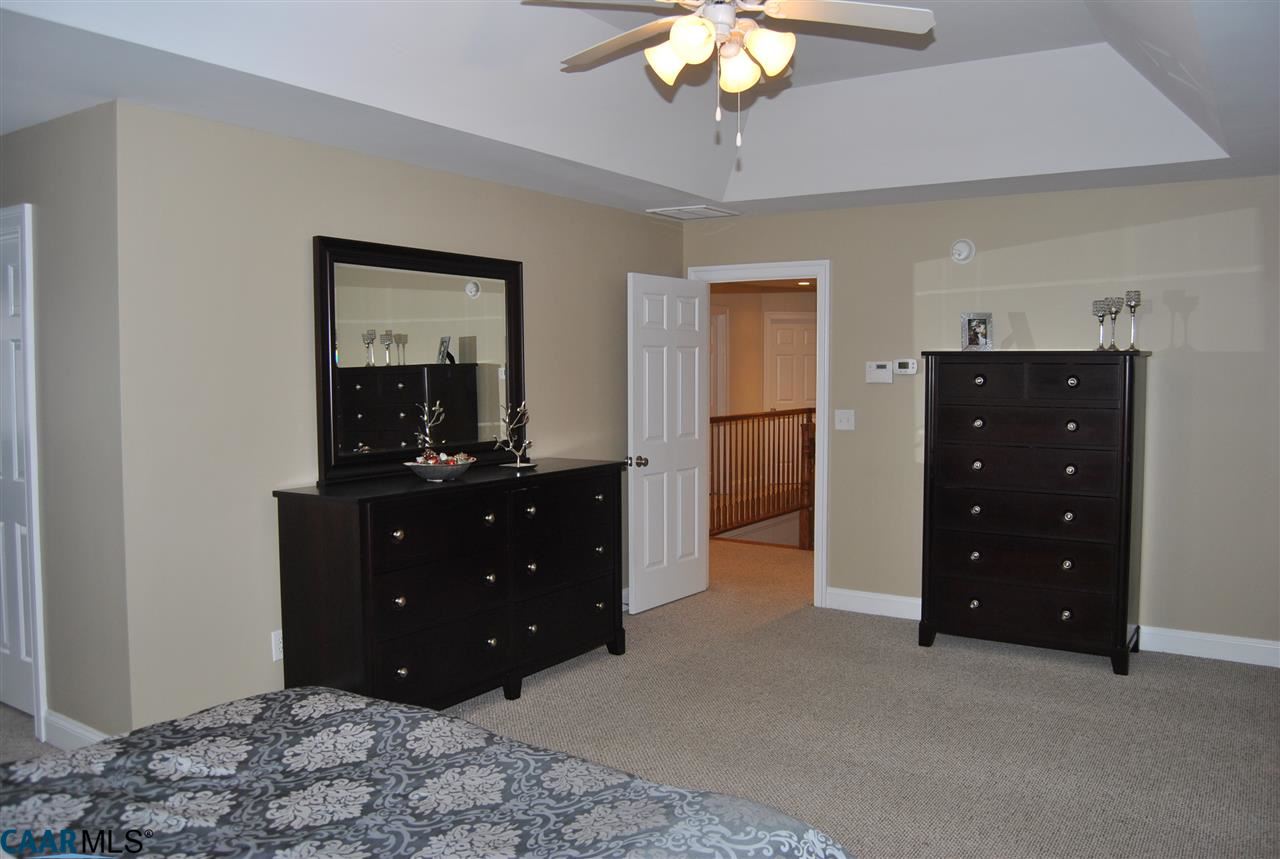 1860 Rhett Court Charlottesville, VA 22903 - Photo 26 of 39 a bedroom with a bed and a dresser
