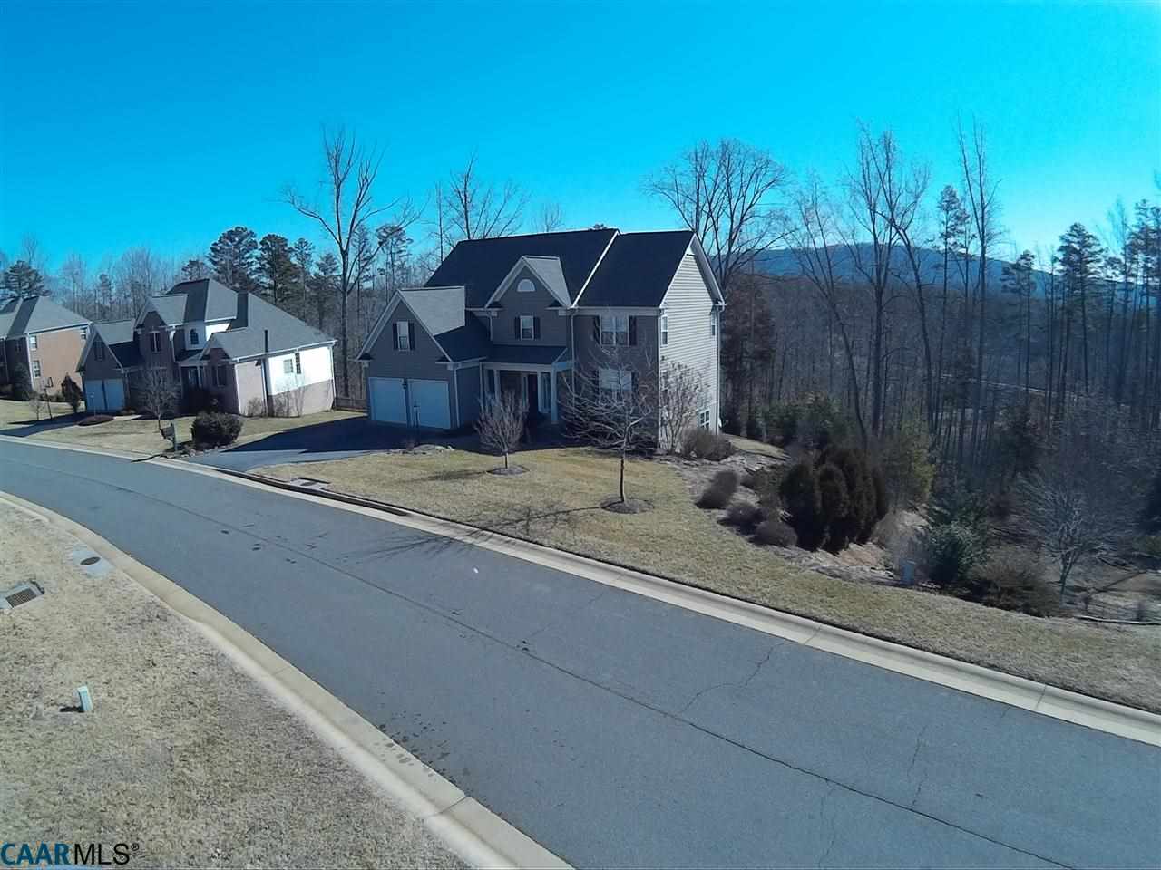 1860 Rhett Court Charlottesville, VA 22903 - Photo 3 of 39 a view of a house with a small yard and a car parked on road