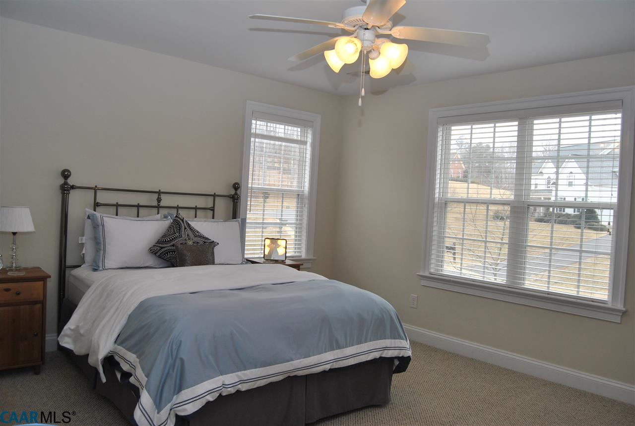 1860 Rhett Court Charlottesville, VA 22903 - Photo 34 of 39 a bedroom with a bed and a chandelier