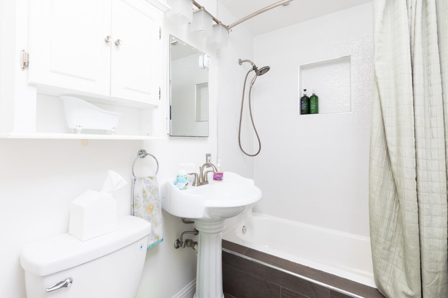 1446 Sharp Avenue Campbell, CA 95008 - Photo 15 of 22 a bathroom with a sink a toilet and a mirror