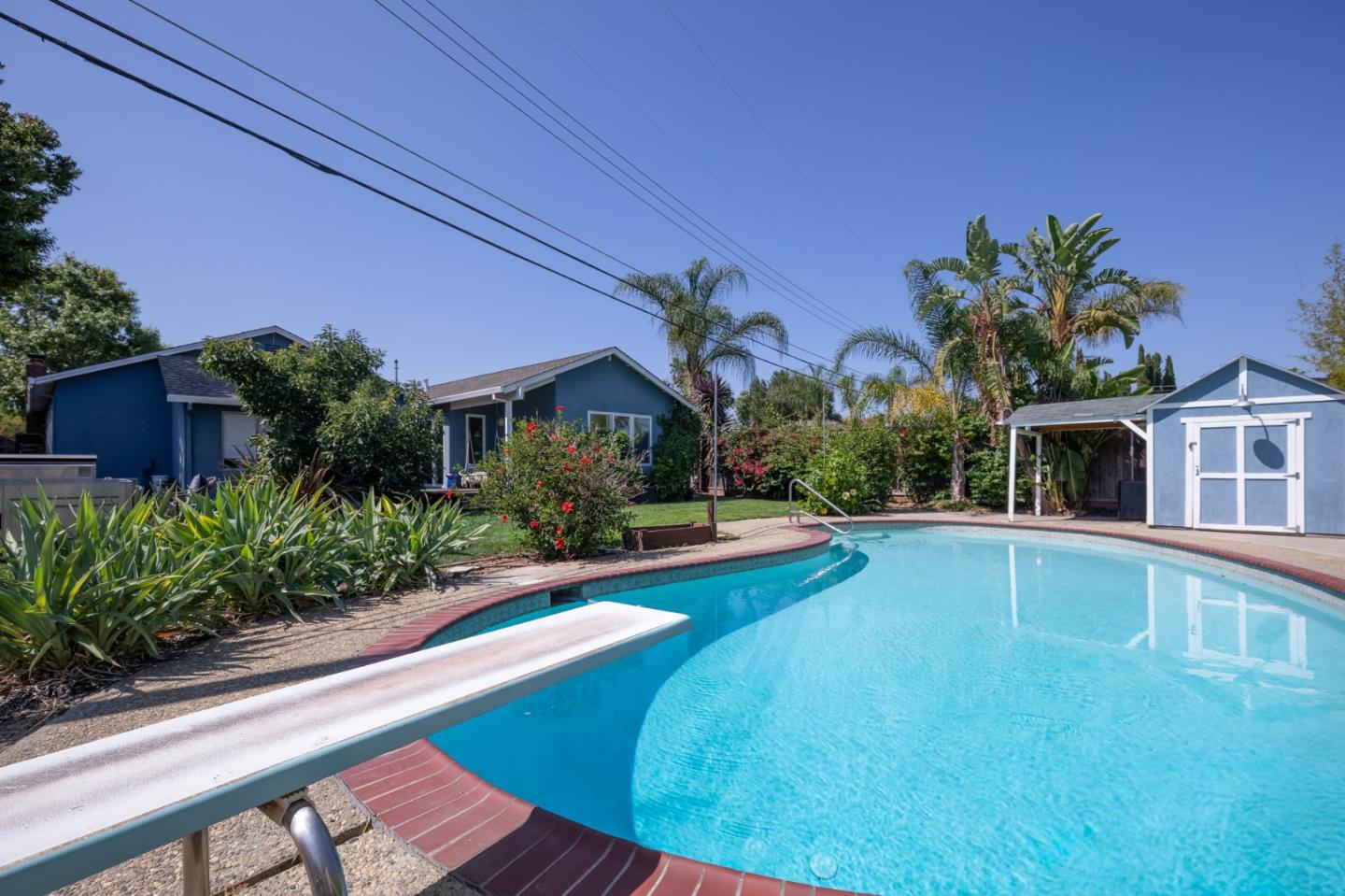 1446 Sharp Avenue Campbell, CA 95008 - Photo 21 of 22 a front view of house with yard and swimming pool