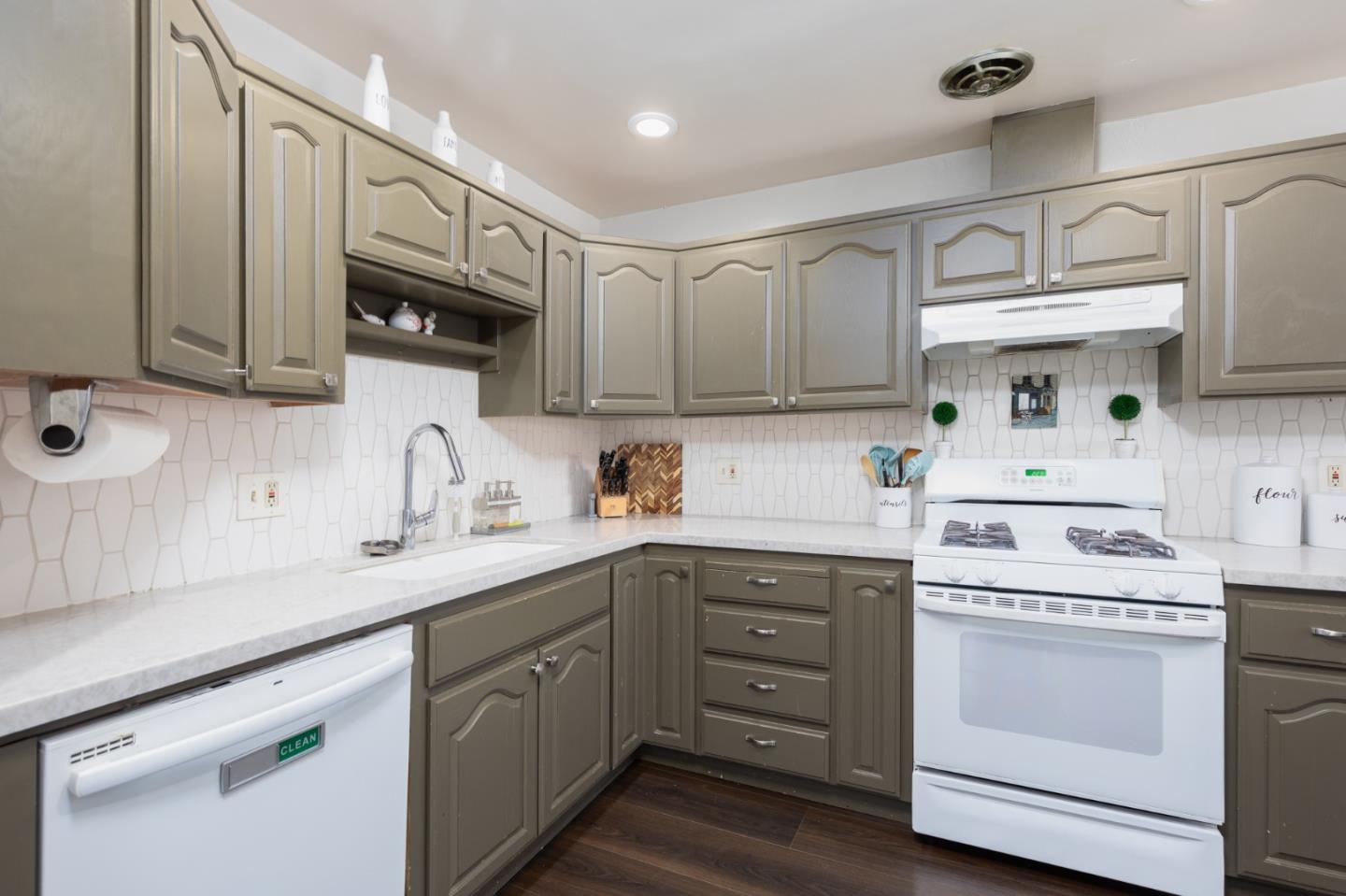 1446 Sharp Avenue Campbell, CA 95008 - Photo 5 of 22 a kitchen with cabinets stainless steel appliances a sink and a counter space