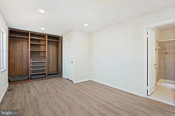 a view of room with hardwood floor and window