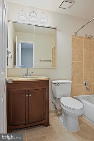 a bathroom with a bathtub and toilet