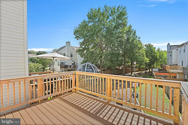 a view of a balcony with wooden floor