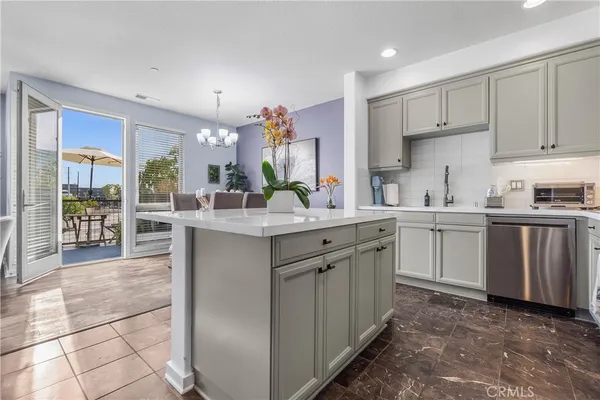 a kitchen with sink cabinets and window