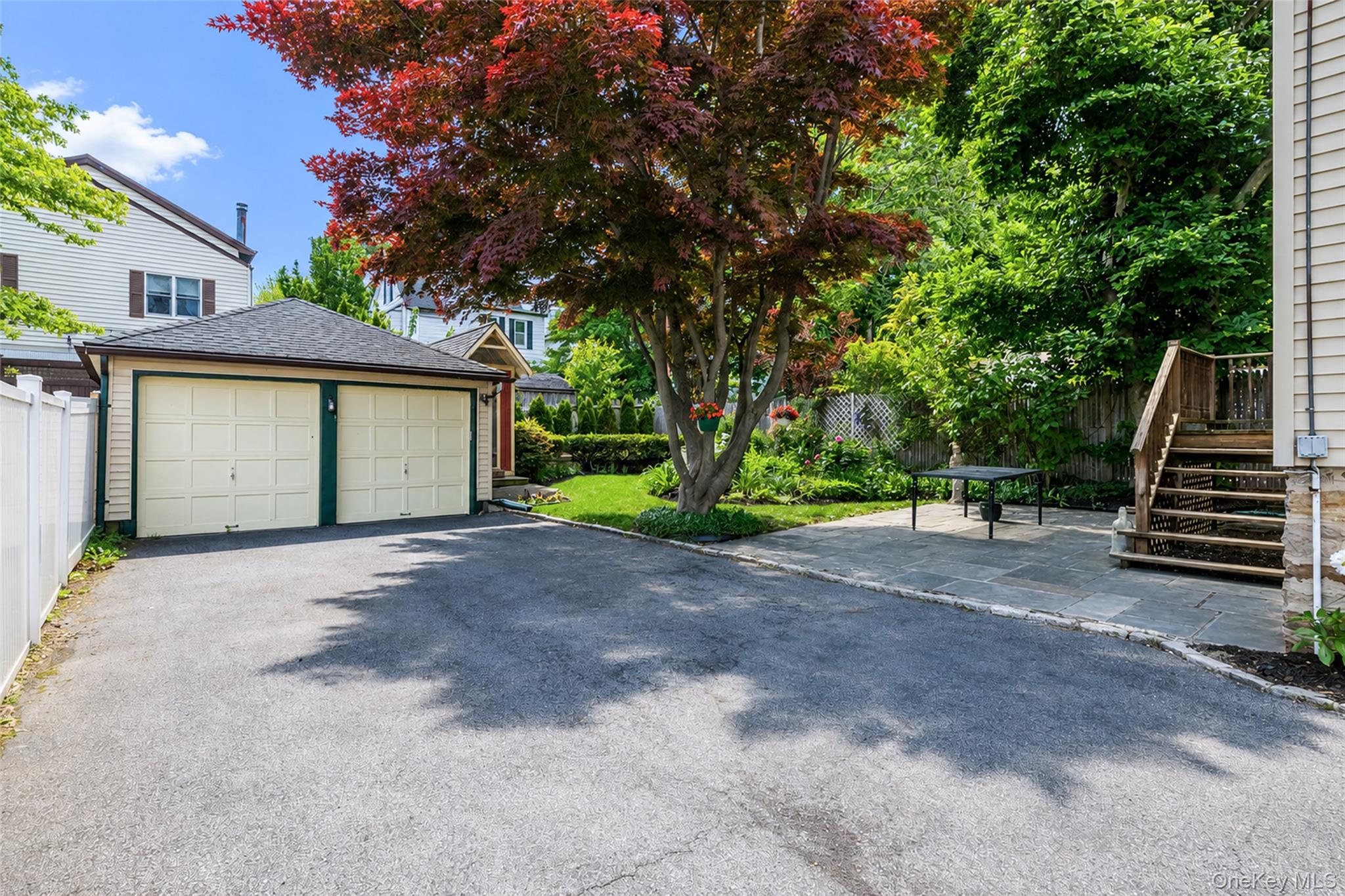 82 Clove Road New Rochelle, NY 10801 - Photo 37 of 39 a view of a house with backyard and trees