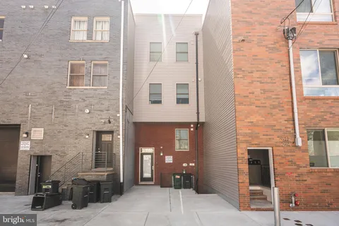 a view of a brick building with many windows