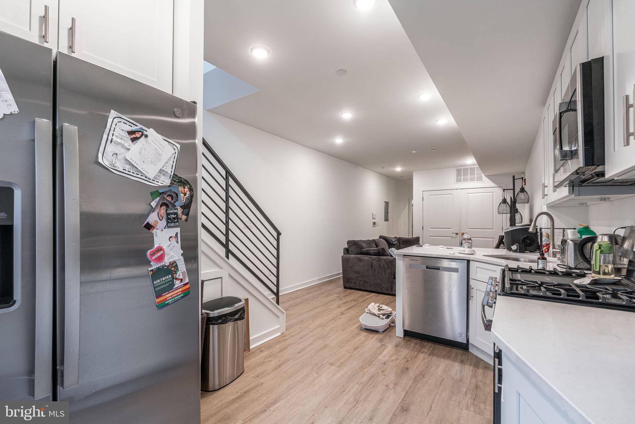 2613 Federal Street Philadelphia, PA 19146 - Photo 8 of 18 a kitchen with stainless steel appliances kitchen island granite countertop a sink stove and refrigerator