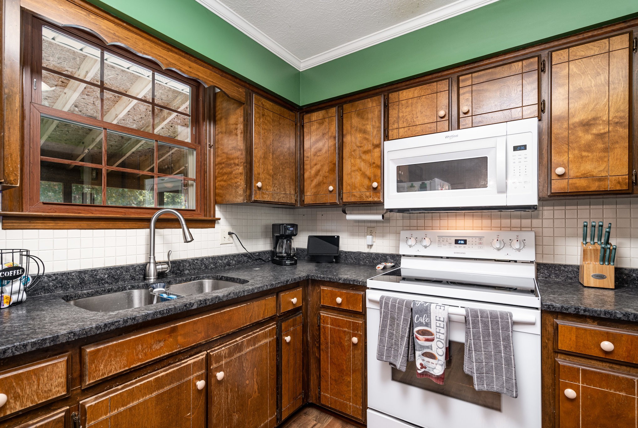 8049 New Chapel Road Springfield, TN 37172 - Photo 6 of 20 a kitchen with stainless steel appliances granite countertop a sink a stove and cabinets