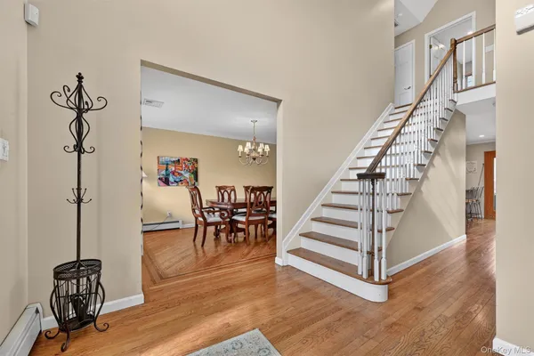 a view of dining room with furniture and wooden floor