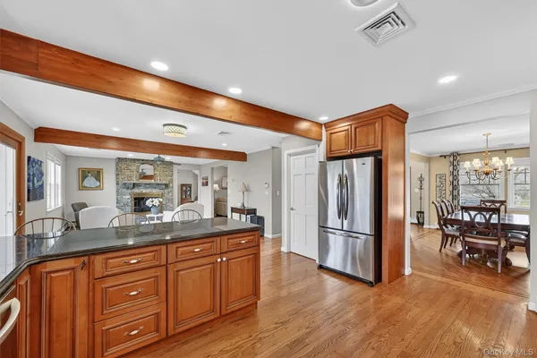 a kitchen with stainless steel appliances granite countertop a refrigerator and a sink