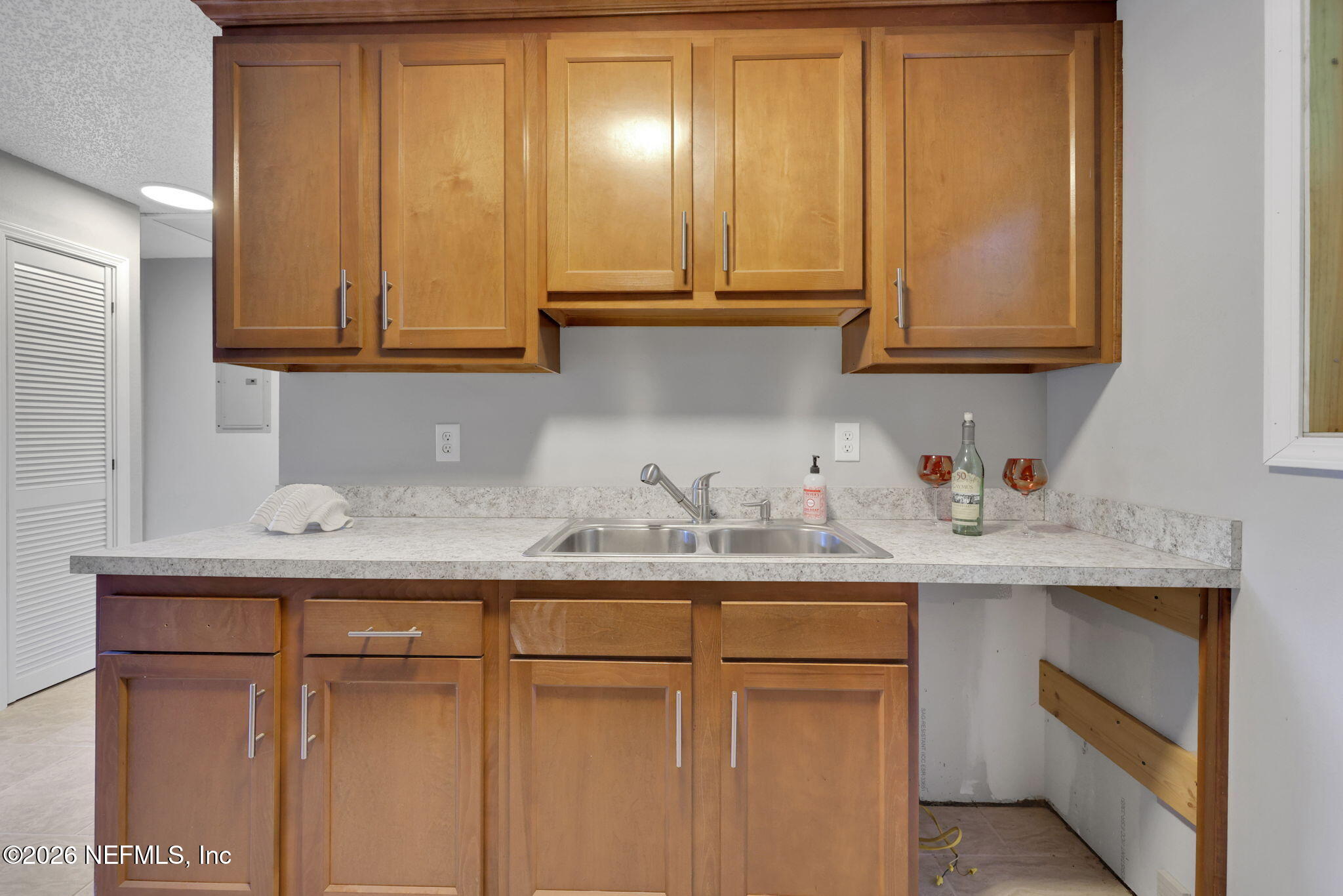 1133 Girvin Road Jacksonville, FL 32225 - Photo 20 of 69 a kitchen with granite countertop stainless steel appliances white cabinets sink and a granite counter top