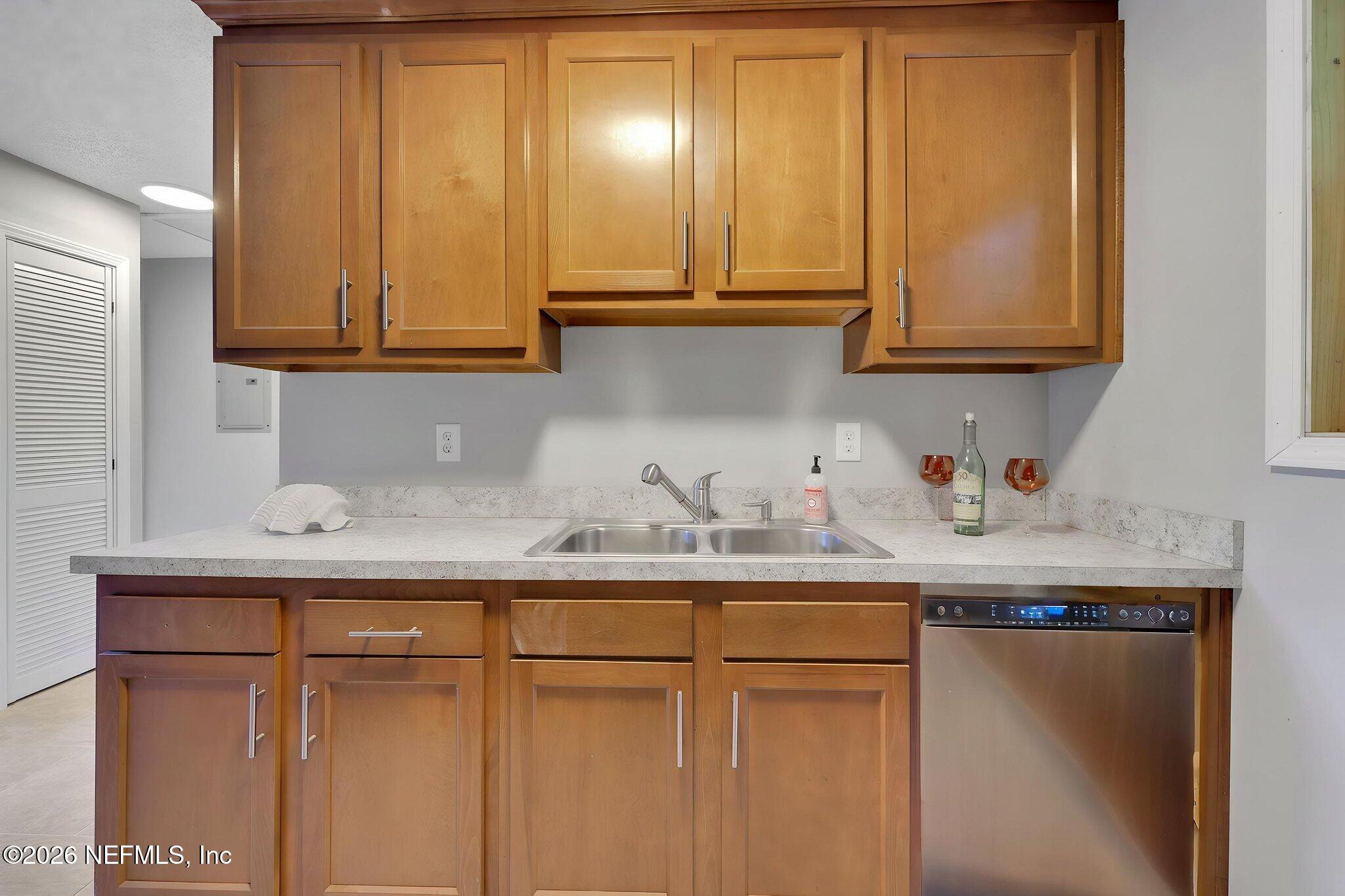 1133 Girvin Road Jacksonville, FL 32225 - Photo 21 of 69 a kitchen with granite countertop stainless steel appliances white cabinets sink and a granite counter top