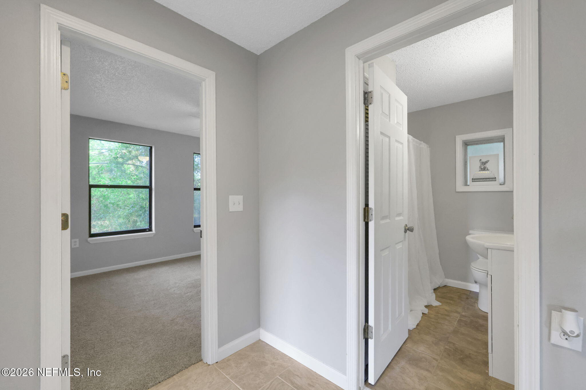 1133 Girvin Road Jacksonville, FL 32225 - Photo 25 of 69 a view of a bathroom from a hallway
