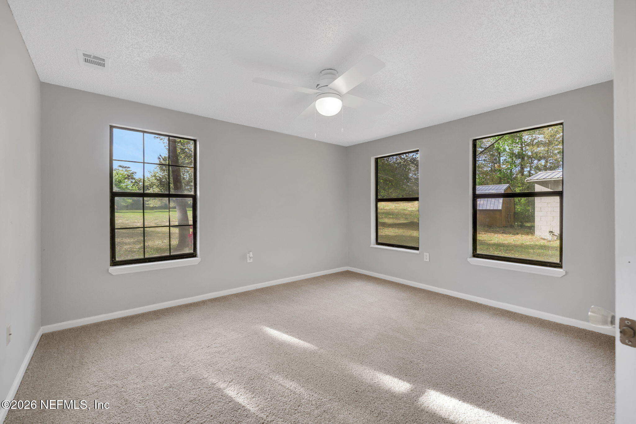 1133 Girvin Road Jacksonville, FL 32225 - Photo 29 of 69 a view of an empty room with a window