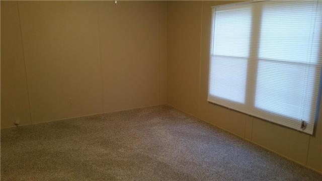 997 Hooper Road Charlotte, TN 37036 - Photo 11 of 16 Large master bedroom with master bath, fresh paint, new carpet, new blinds, and large closet.