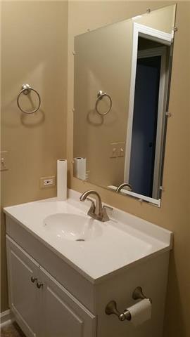 997 Hooper Road Charlotte, TN 37036 - Photo 14 of 16 Bath #2 has new toilet, new vanity, new sink, new shower, new vinyl, and fresh paint.