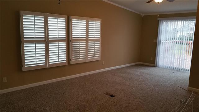 997 Hooper Road Charlotte, TN 37036 - Photo 3 of 16 Another view of the den. Door leading to the back yard as well as a large closet for more storage!