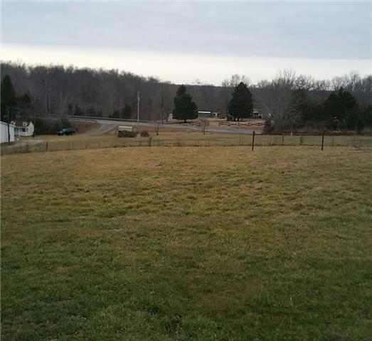 997 Hooper Road Charlotte, TN 37036 - Photo 7 of 16 Nice level back yard. Plenty of room for kids and pets to play. Great area for a privacy fence.