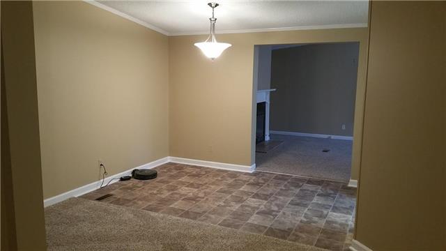 997 Hooper Road Charlotte, TN 37036 - Photo 10 of 16 Dining room with fresh paint and new vinyl. Conveniently located between the kitchen, den, and living room!