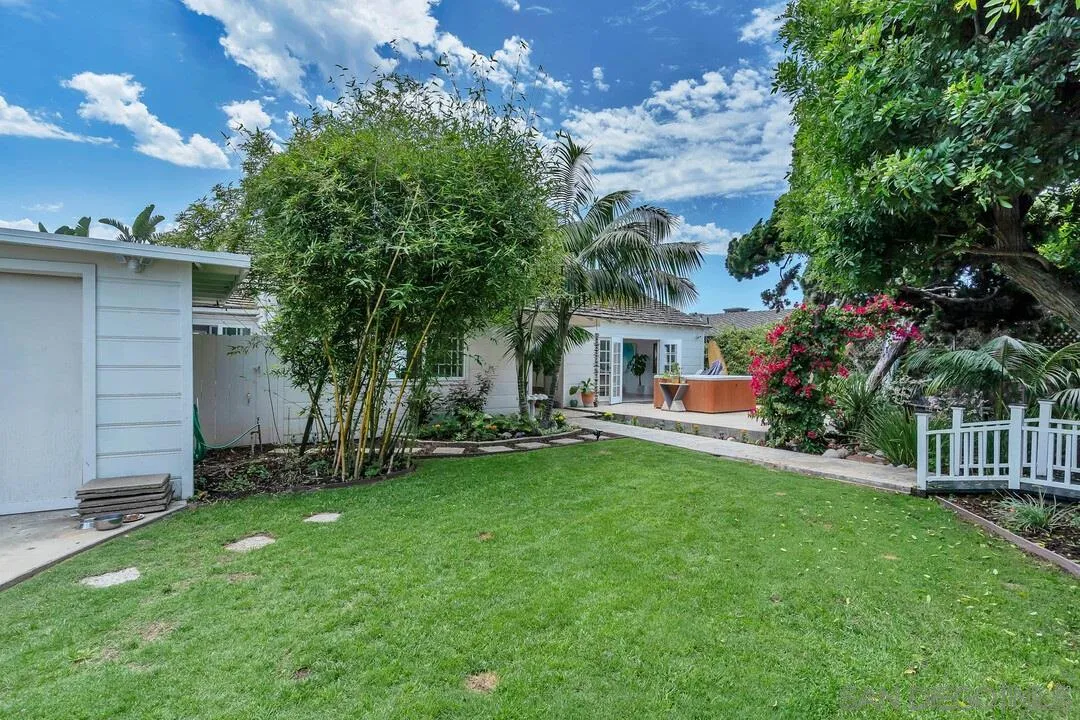 796 Neptune Avenue Encinitas, CA 92024 - Photo 13 of 49 a front view of a house with a garden