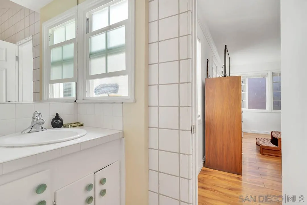 796 Neptune Avenue Encinitas, CA 92024 - Photo 18 of 49 a bathroom with a sink and a mirror
