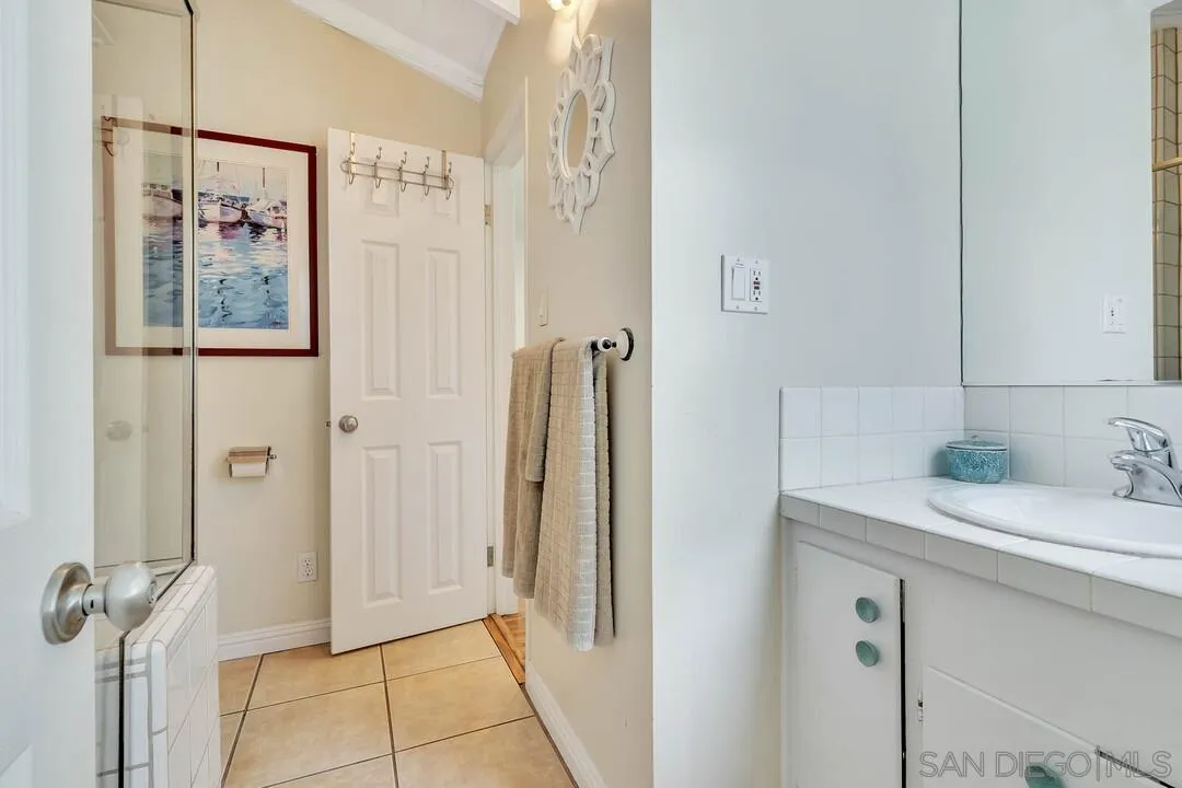796 Neptune Avenue Encinitas, CA 92024 - Photo 19 of 49 a bathroom with a sink and a mirror