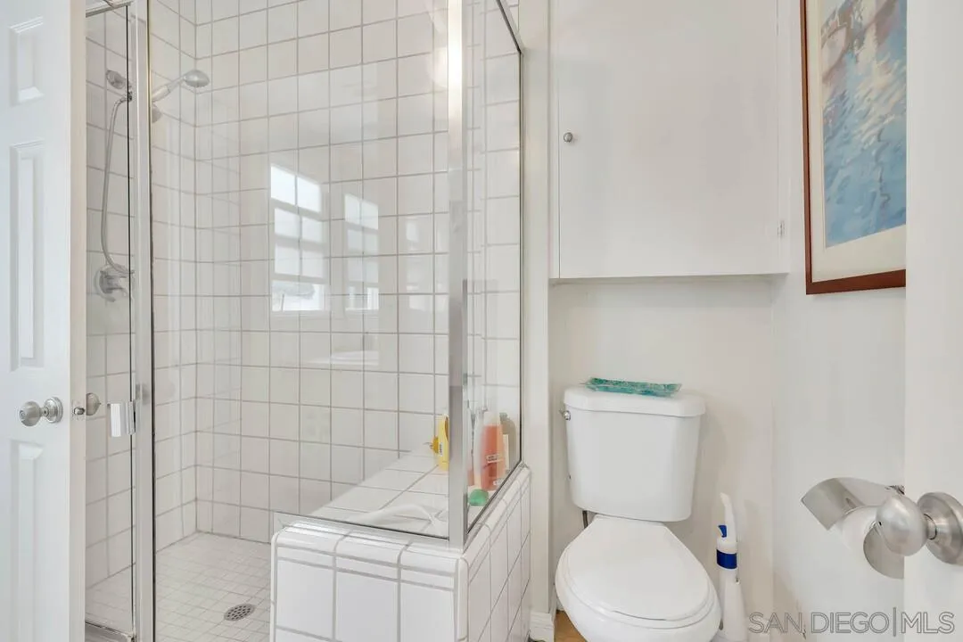 796 Neptune Avenue Encinitas, CA 92024 - Photo 20 of 49 a white toilet sitting next to a bathroom sink