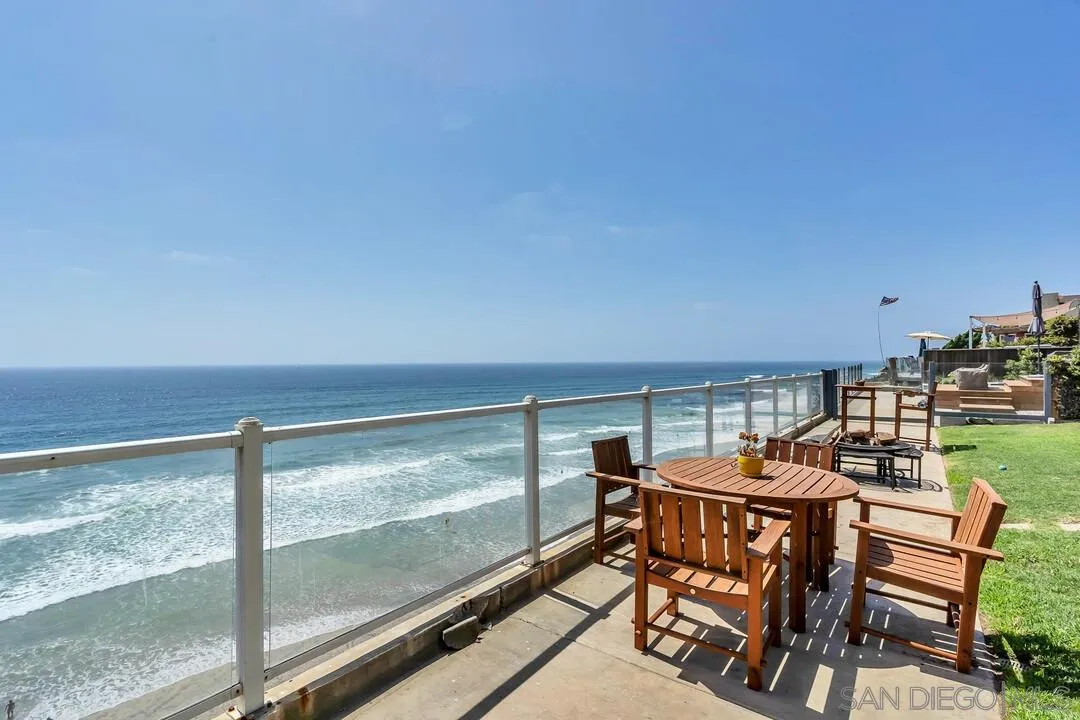 796 Neptune Avenue Encinitas, CA 92024 - Photo 2 of 49 a dining room with furniture and a floor to ceiling window
