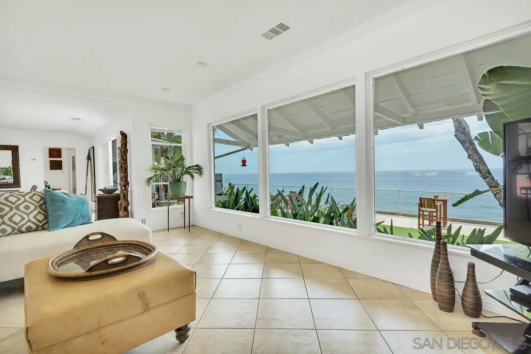 796 Neptune Avenue Encinitas, CA 92024 - Photo 29 of 49 a bedroom with furniture and a large window