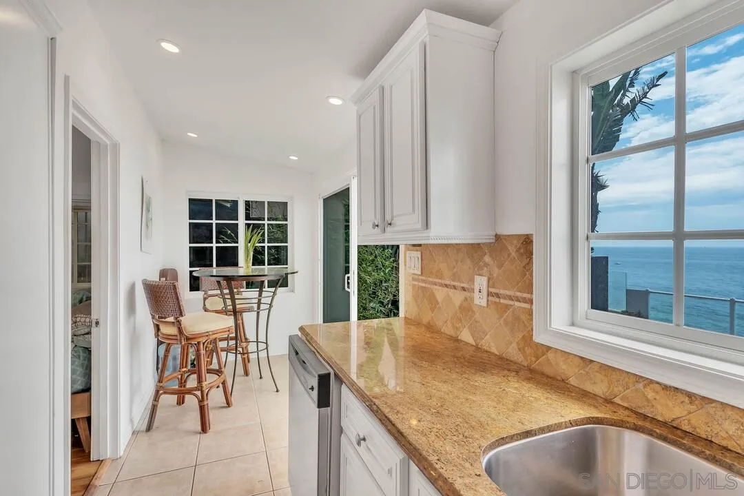 796 Neptune Avenue Encinitas, CA 92024 - Photo 33 of 49 a kitchen with granite countertop sink and granite top