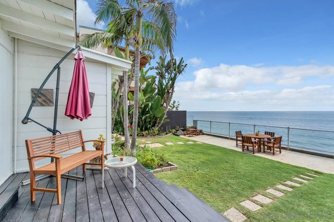 796 Neptune Avenue Encinitas, CA 92024 - Photo 42 of 49 an outdoor sitting area with chairs