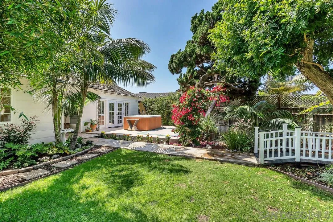 796 Neptune Avenue Encinitas, CA 92024 - Photo 9 of 49 a view of a chair and table in backyard of the house