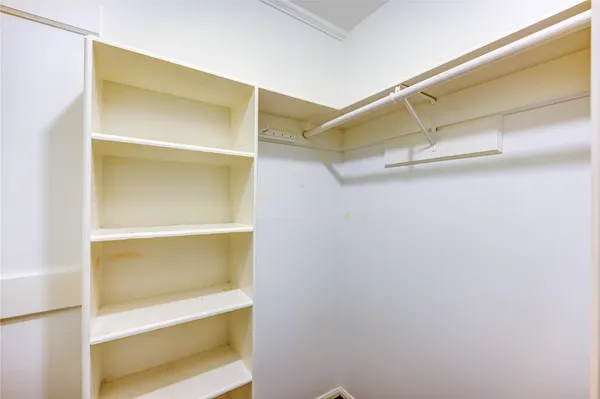 a view of an empty walk in closet