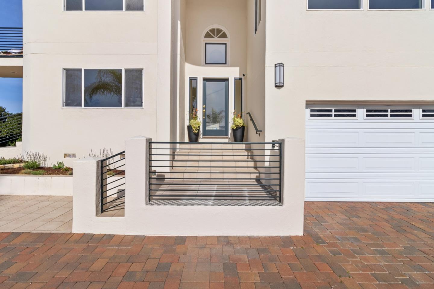 320 El Caminito Road Carmel Valley, CA 93924 - Photo 5 of 62 a view of a brick house with many windows