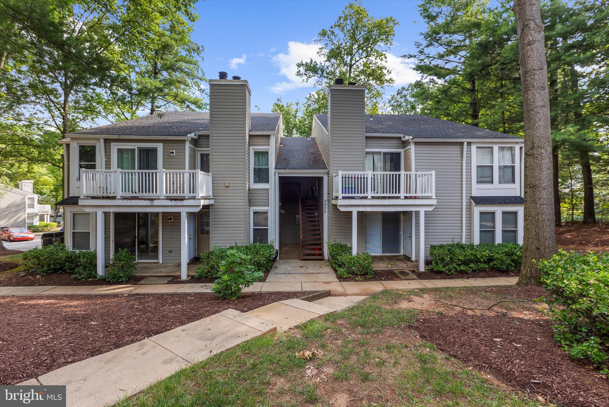 5920 Watch Chain Way, Unit 5102 Columbia, MD 21044 - Photo 1 of 29 a front view of a house with garden and trees