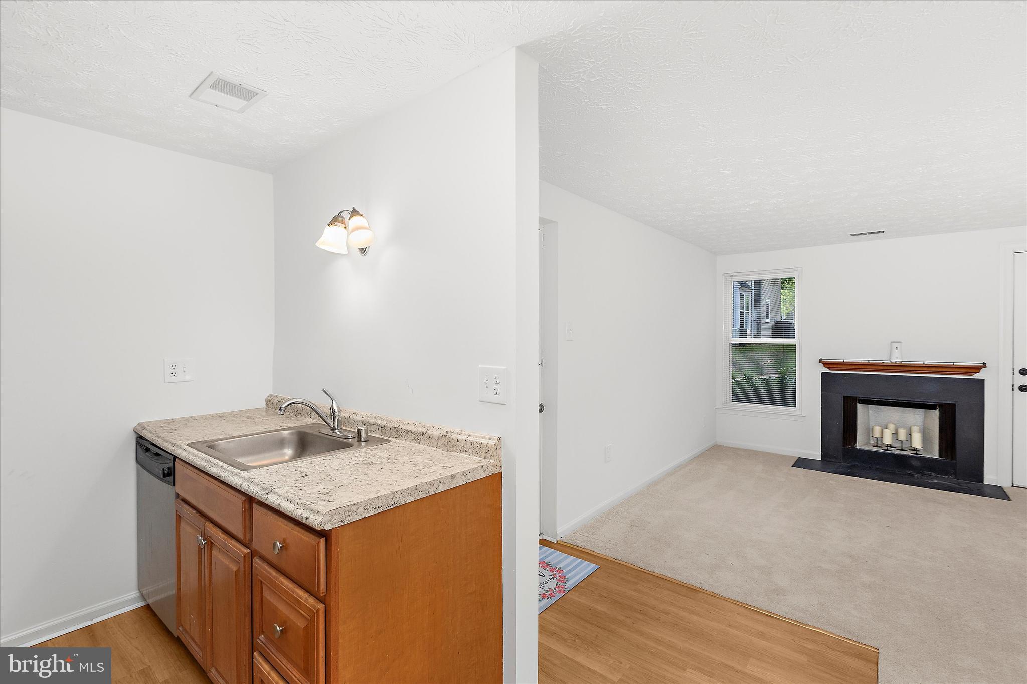 5920 Watch Chain Way, Unit 5102 Columbia, MD 21044 - Photo 11 of 29 a view of an empty room and fire place