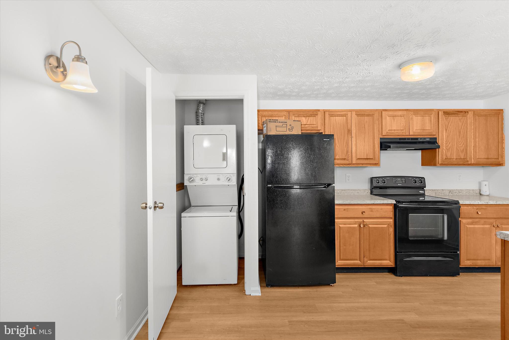 5920 Watch Chain Way, Unit 5102 Columbia, MD 21044 - Photo 14 of 29 a kitchen with stainless steel appliances granite countertop a refrigerator and a stove