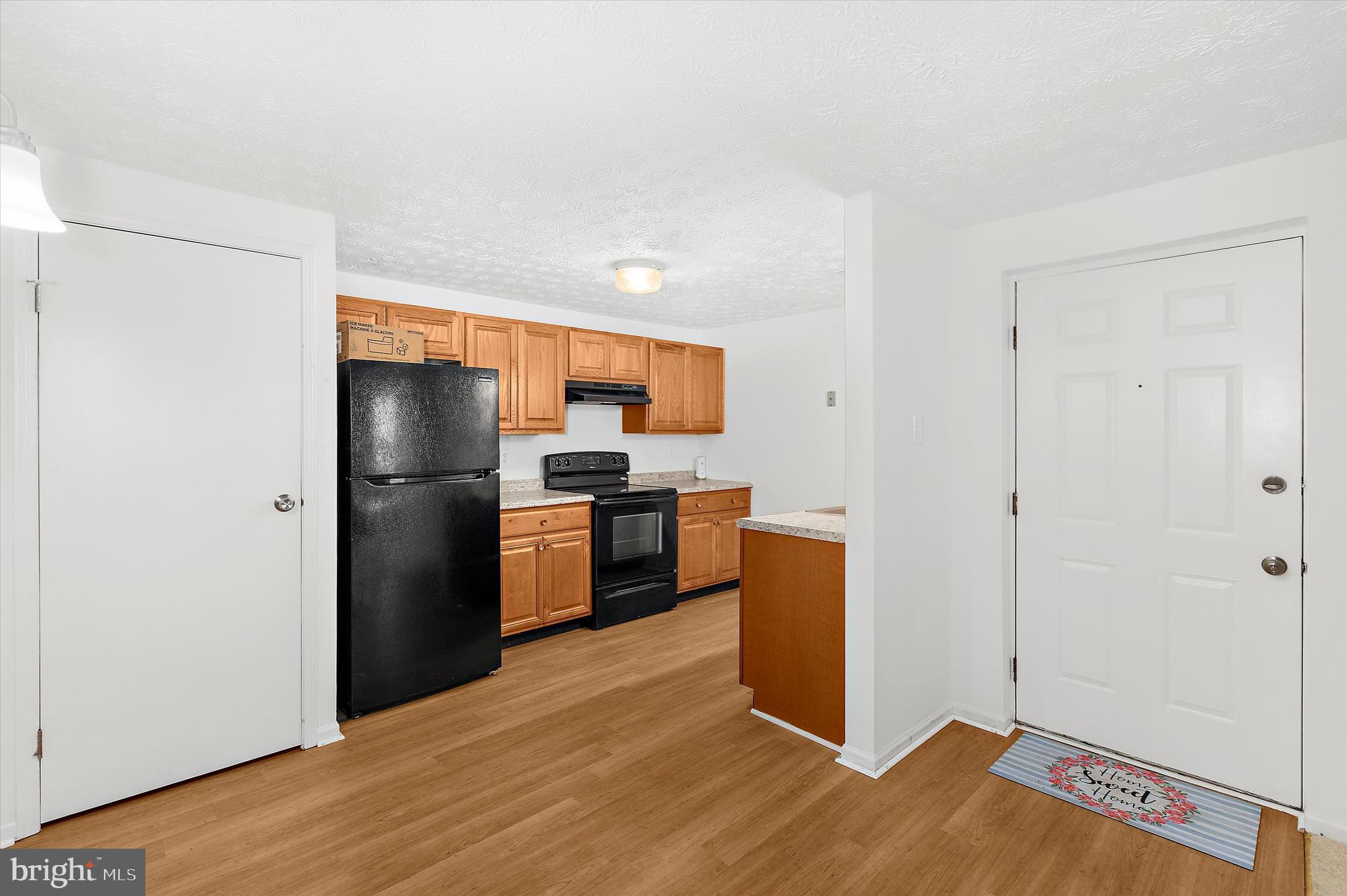 5920 Watch Chain Way, Unit 5102 Columbia, MD 21044 - Photo 17 of 29 a kitchen with stainless steel appliances a refrigerator and a stove top oven