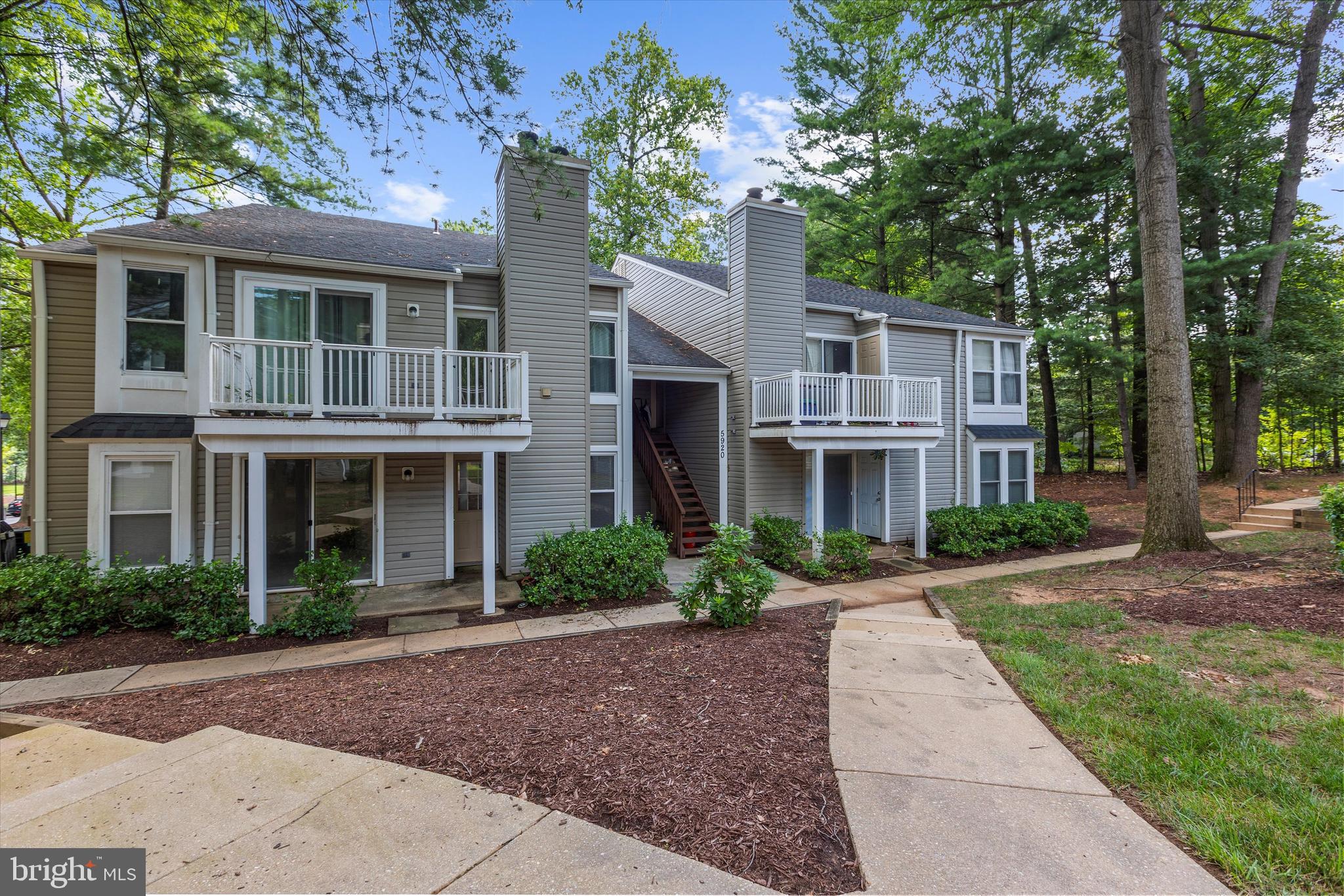 5920 Watch Chain Way, Unit 5102 Columbia, MD 21044 - Photo 2 of 29 a front view of a house with a garden
