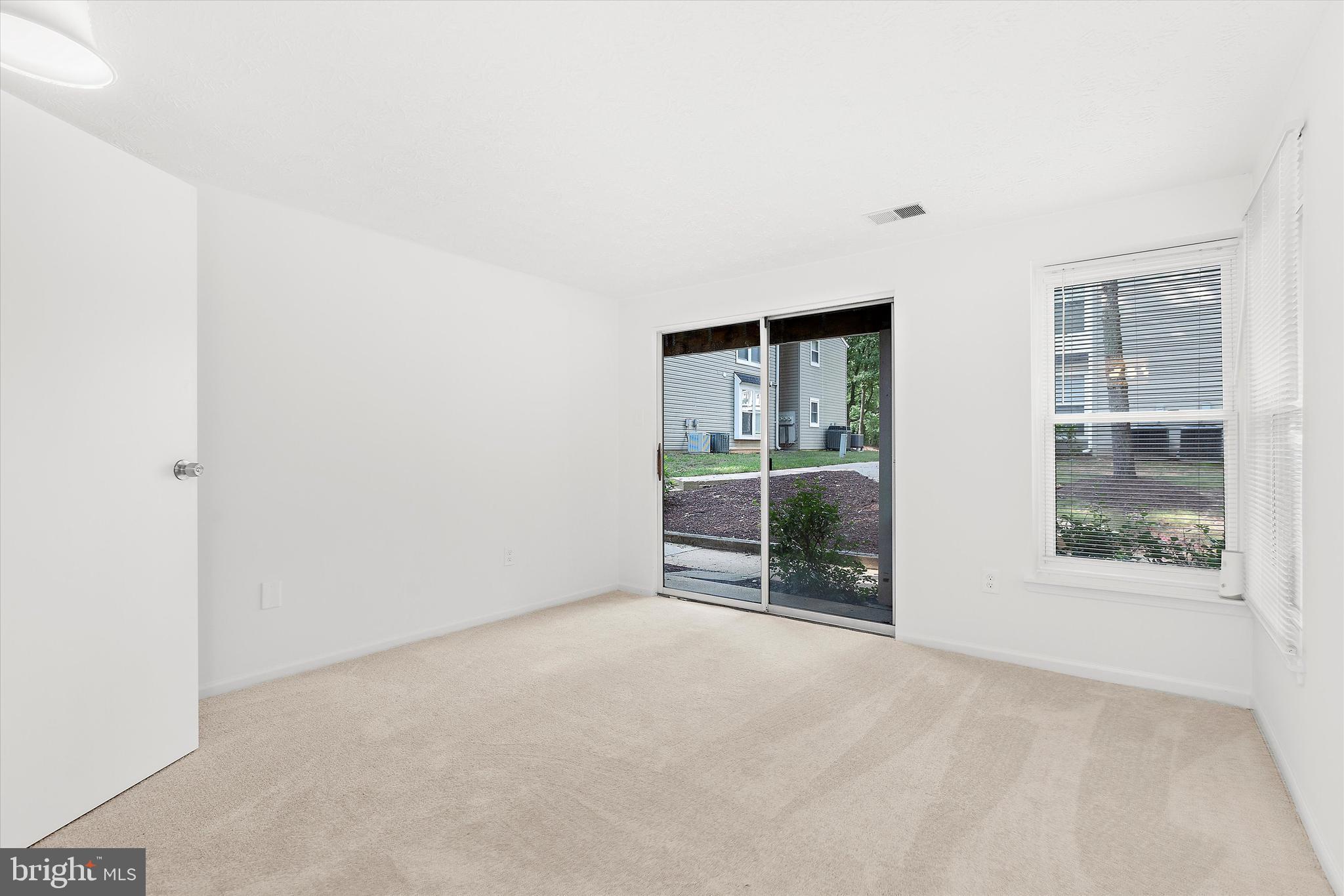 5920 Watch Chain Way, Unit 5102 Columbia, MD 21044 - Photo 25 of 29 an empty room with floor to ceiling window