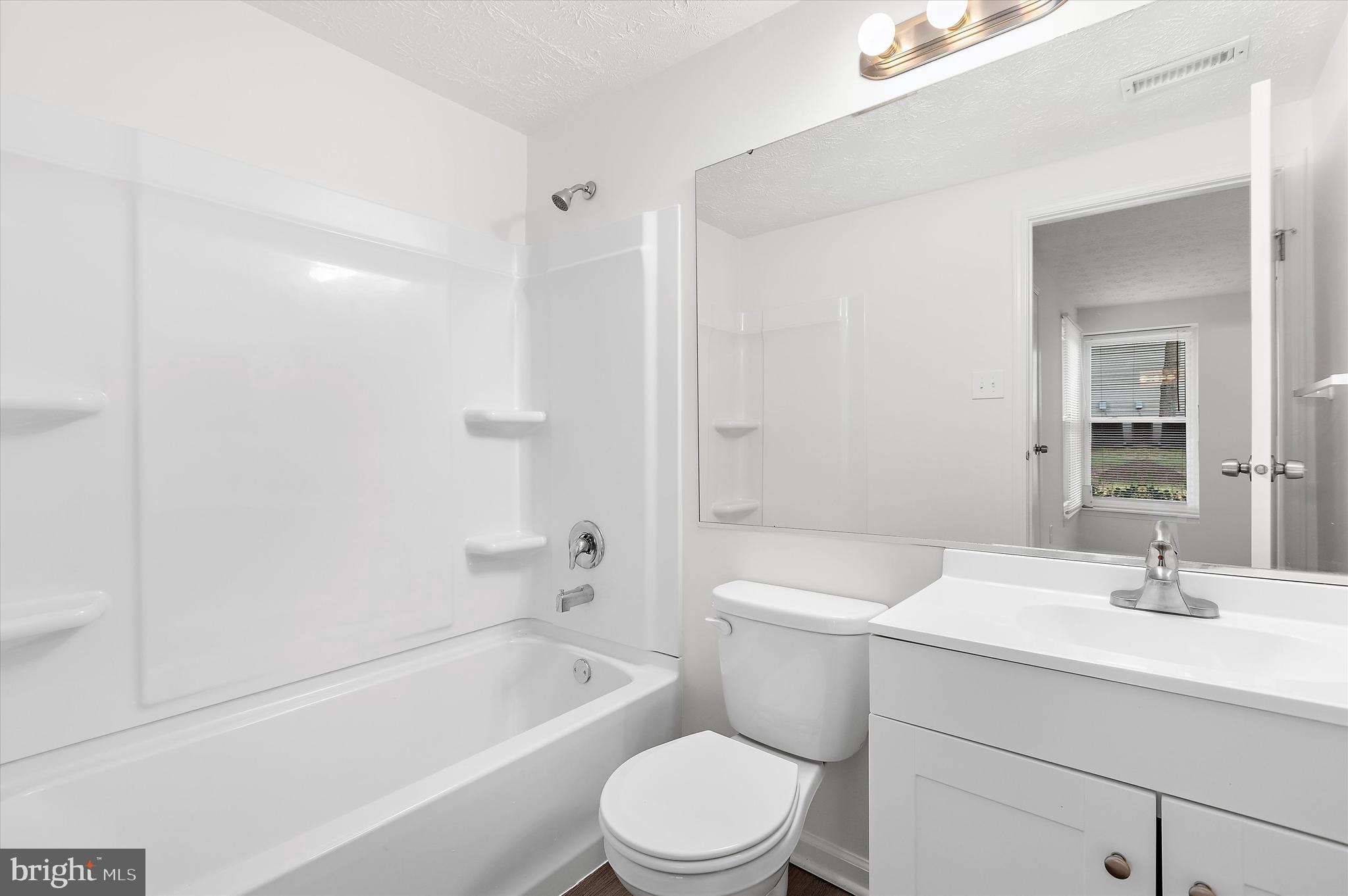 5920 Watch Chain Way, Unit 5102 Columbia, MD 21044 - Photo 26 of 29 a bathroom with a sink a toilet and shower
