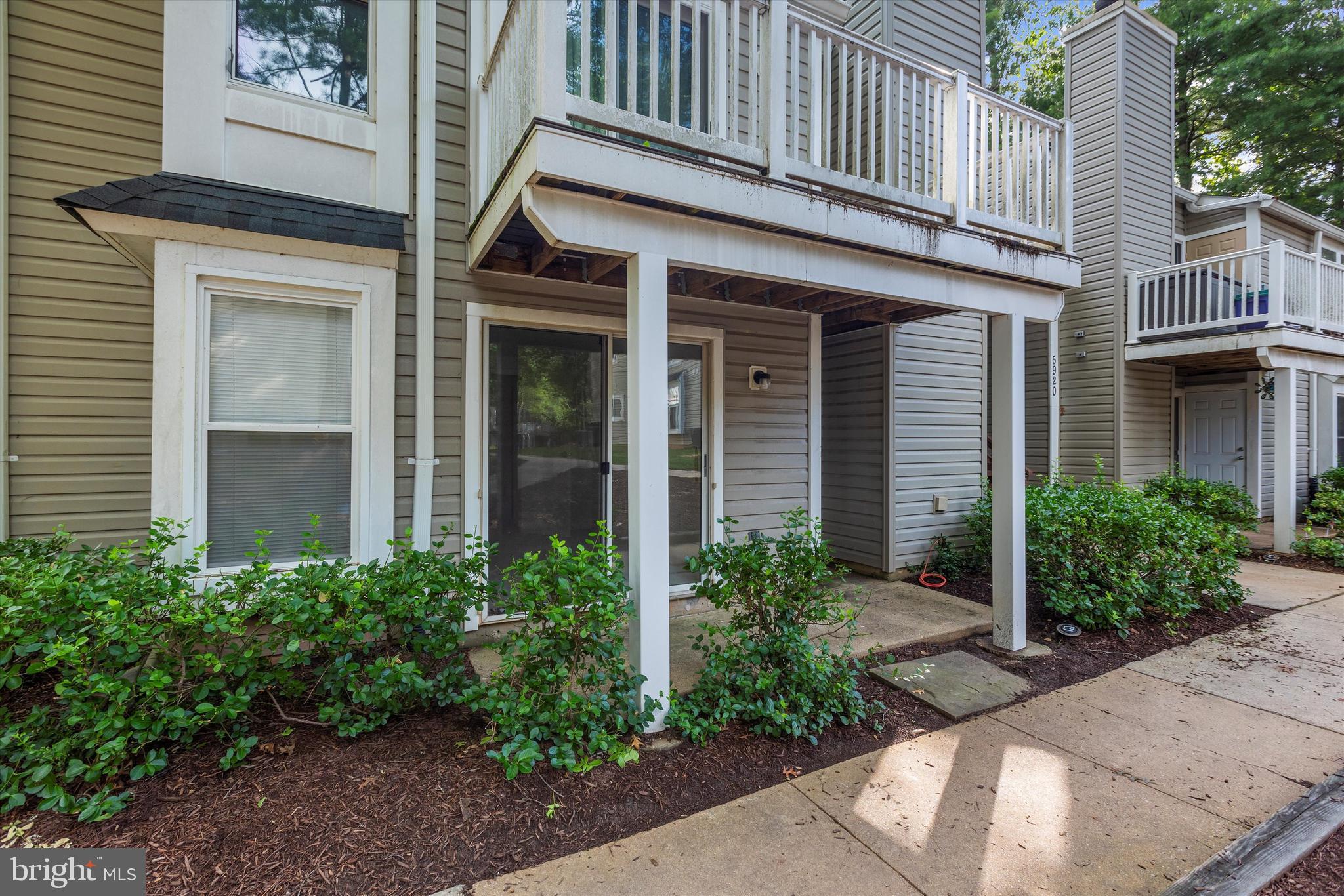 5920 Watch Chain Way, Unit 5102 Columbia, MD 21044 - Photo 27 of 29 a view of a white house with a large windows