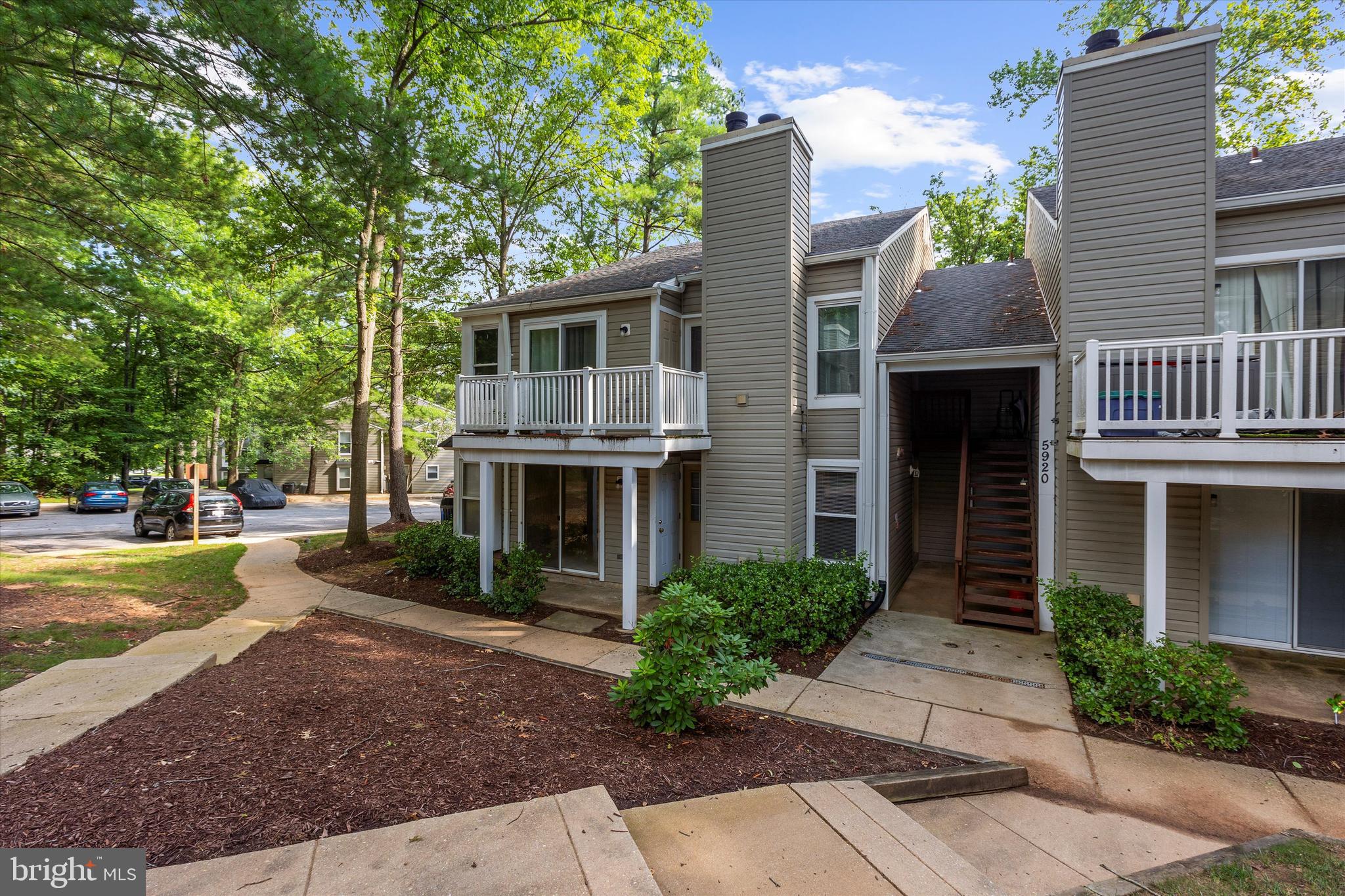 5920 Watch Chain Way, Unit 5102 Columbia, MD 21044 - Photo 3 of 29 a front view of a house with garden
