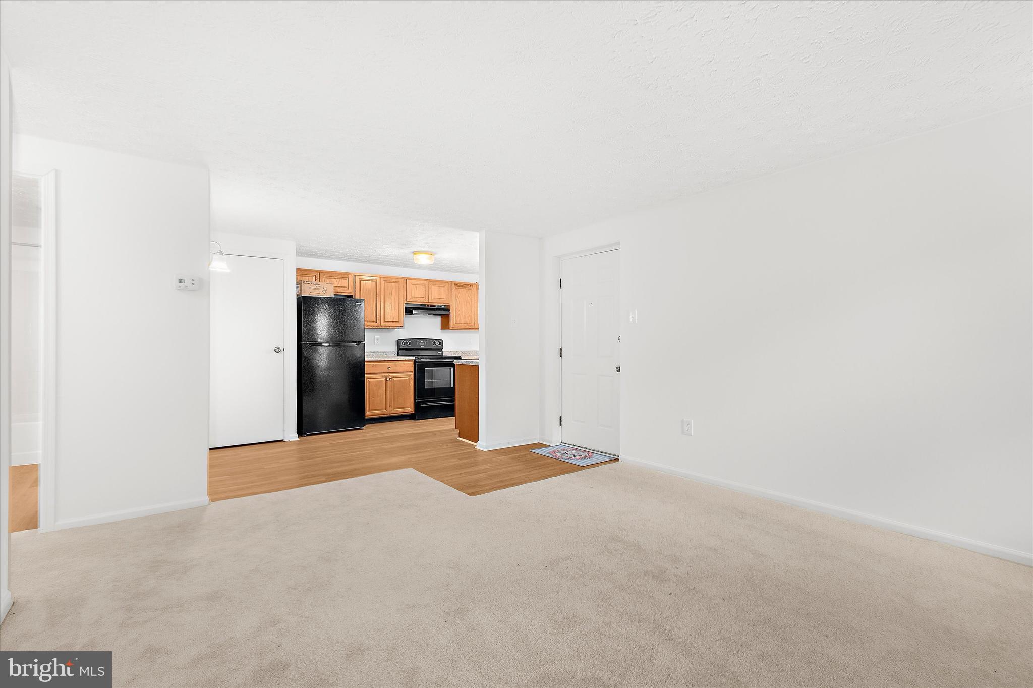 5920 Watch Chain Way, Unit 5102 Columbia, MD 21044 - Photo 7 of 29 a view of an empty room with a fireplace