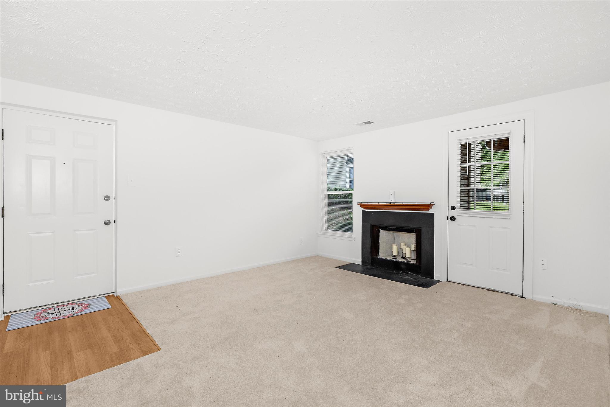 5920 Watch Chain Way, Unit 5102 Columbia, MD 21044 - Photo 8 of 29 an empty room with a fireplace and a window