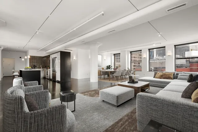 a living room with furniture and a table