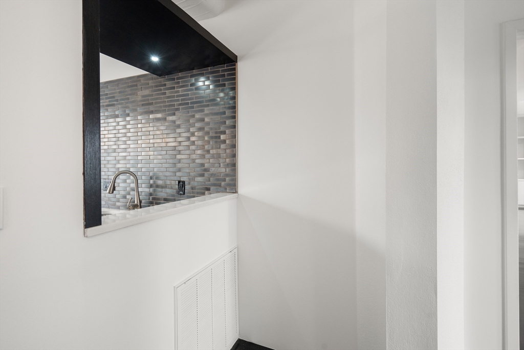 453 Washington Street, Unit 11B Boston, MA 02111 - Photo 11 of 30 a bathroom with a bathtub