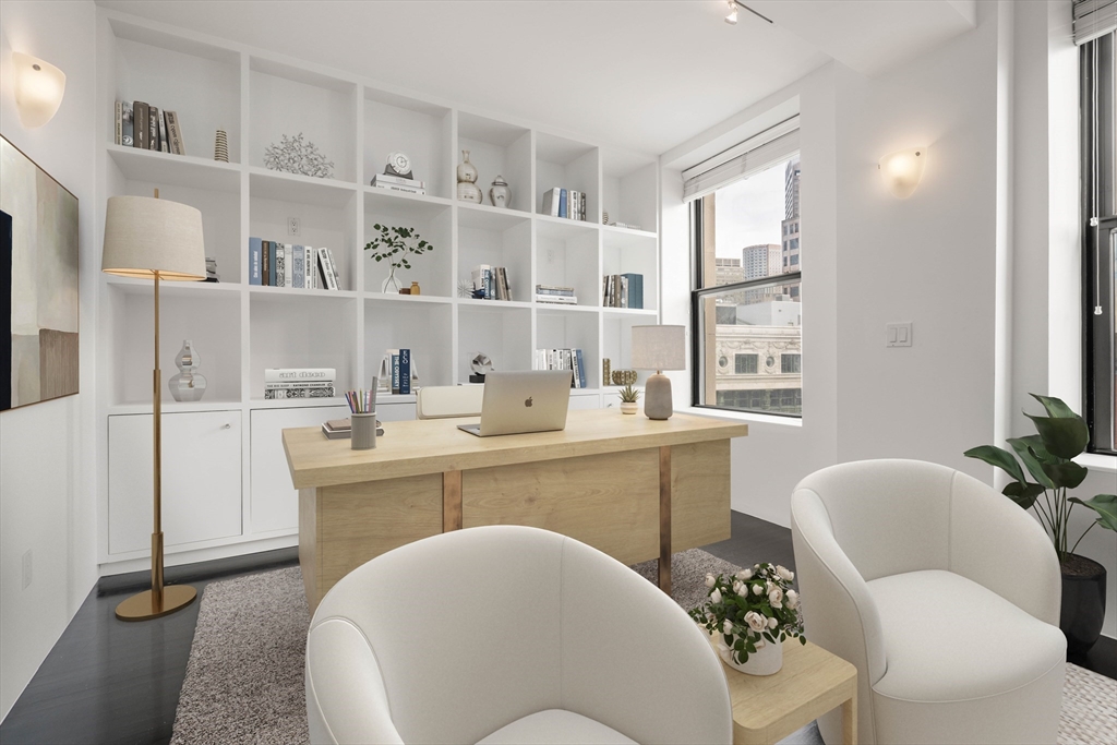 453 Washington Street, Unit 11B Boston, MA 02111 - Photo 17 of 30 a dining room with furniture a window and wooden floor
